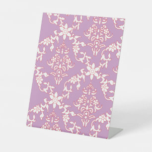 A vibrant textile design featuring intricate patte pedestal sign