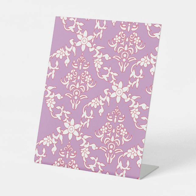 A vibrant textile design featuring intricate patte pedestal sign (Front)