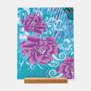 A vibrant textile design featuring purple and turq acrylic sign