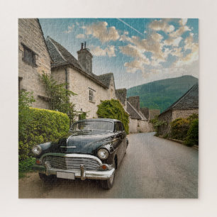 A vintage car parked in a quaint village jigsaw puzzle