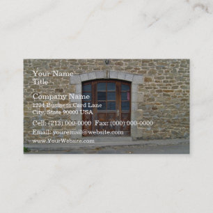A vintage door and window in stone wall business card