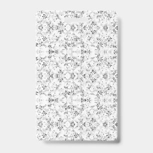 A visually striking white and black patterned wall ID badge