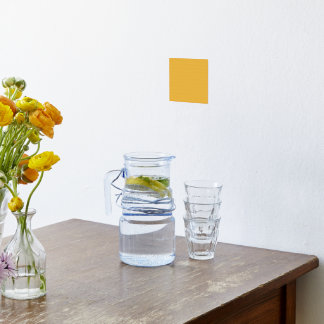 A vivid orange square surrounded by a white border foil prints