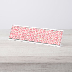 A vivid red and orange abstract design with swirli desk name plate