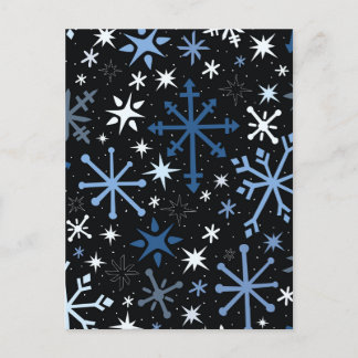 A whimsical flurry of blue snowflakes on black postcard