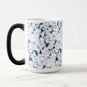a white and blue background with a pattern magic mug
