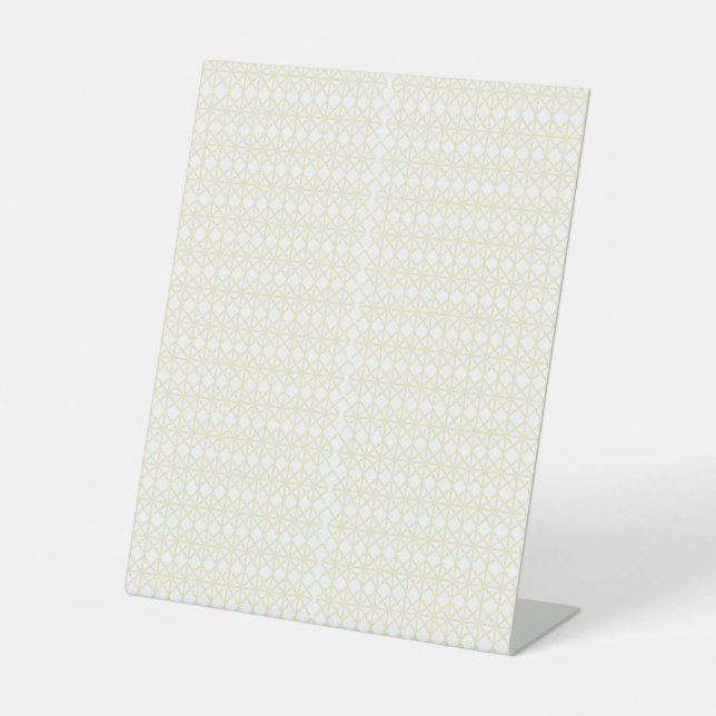 a white and gold geometric pattern pedestal sign (Front)