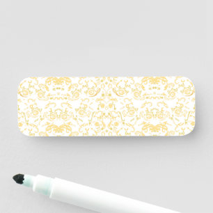 a white and gold wallpaper with a pattern on it name tag