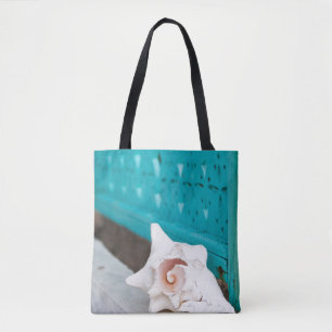 A White And Pink Jamaican Sea Shell Sits Alone Tote Bag