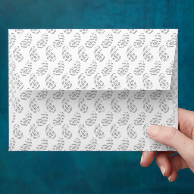 a white background with a pattern in the middle envelope (Hand)