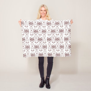 a white background with a red pattern on it fleece blanket