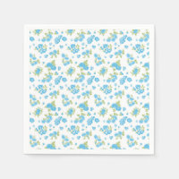 a white background with blue flowers and green lea
