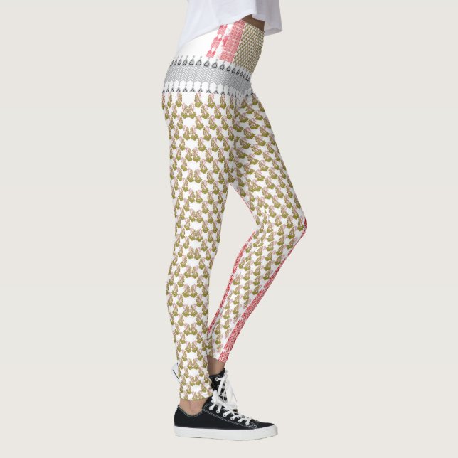a white background with green leaves on it leggings (Right)