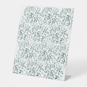 a white background with lots of drops of water pedestal sign