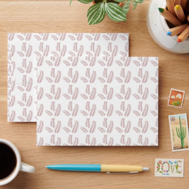 a white background with pink leaves on it envelope (Desk)