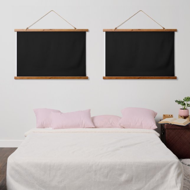 A white clock displayed prominently against a soli hanging tapestry (Bedroom)