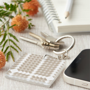 A white, equilateral triangle centred on a plain key ring
