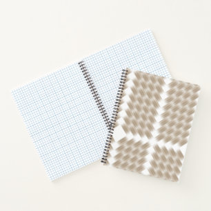 A white, equilateral triangle centred on a plain notebook