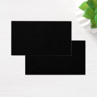 A white full moon shines brightly against a dark n