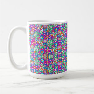 A white mug featuring a vibrant, colourful mandala