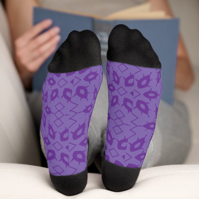 A white wrapping paper with a repeating pattern of socks (Bottom)