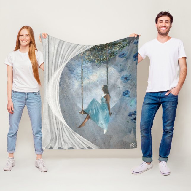 A woman in a blue dress on a swing  fleece blanket (In Situ)