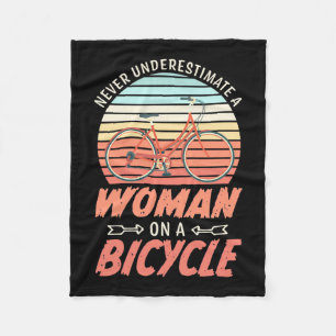 A Woman On A Bicycle Fleece Blanket