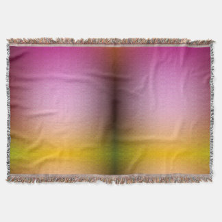 A woven blanket displays a gradient of pink
