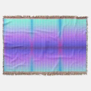 A woven blanket with a gradient pattern of purple