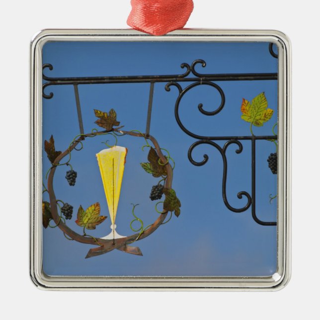 A wrought iron sign that illustrates the theme metal tree decoration (Front)