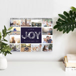 A Year of Joy | 2019 Photo Calendar<br><div class="desc">Share a favourite memory on each page of this 2019 photo calendar, with photos framed with a botanical leaves pattern in seasonal colours. Cover features a thumbnail version of each photo with "a year of joy" in the centre in white letters formed by holiday botanicals and berries. Personalise the cover...</div>