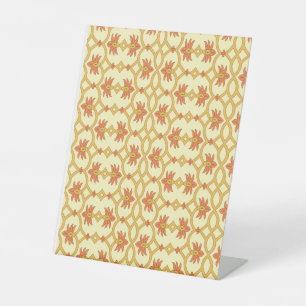 a yellow and white background with an intricate de pedestal sign