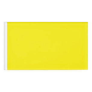 a yellow background with a black border name tag