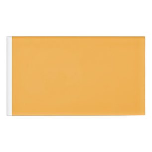 a yellow background with a black border name tag