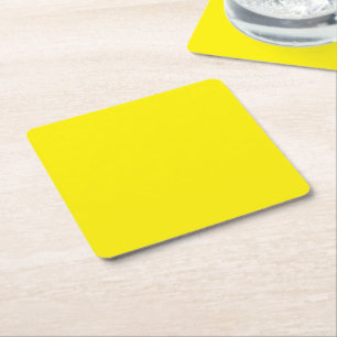 a yellow background with a black border square paper coaster