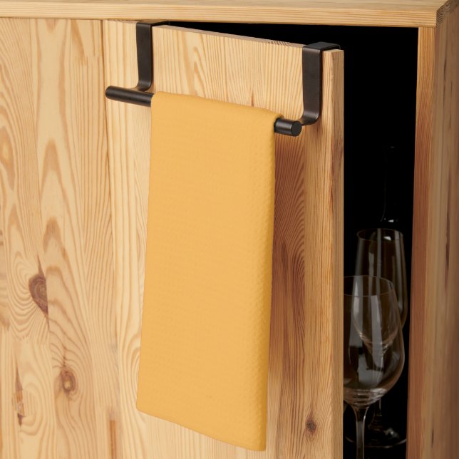 a yellow background with a tea towel (Thirds Fold)