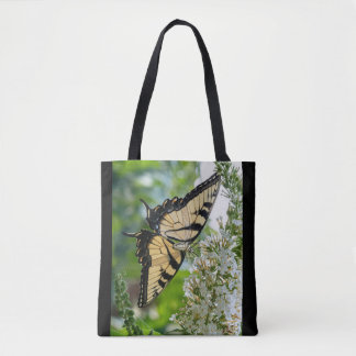 A yellow butterfly tote bag