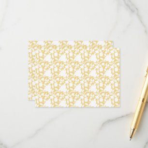 A yellow rug with a repeating motif pattern resemb enclosure card