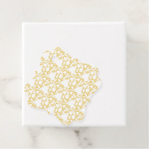 A yellow rug with a repeating motif pattern resemb favour tags
