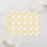 A yellow rug with a repeating motif pattern resemb