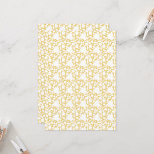 A yellow rug with a repeating motif pattern resemb invitation