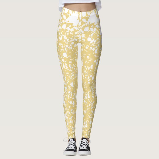 A yellow rug with a repeating motif pattern resemb leggings (Front)