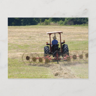 A young boy driving a tractor harvesting postcard