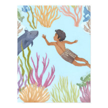 A young boy free diving in the caribbean