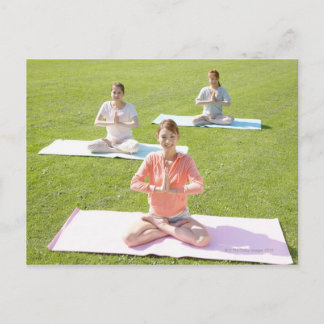 A young woman doing yoga postcard