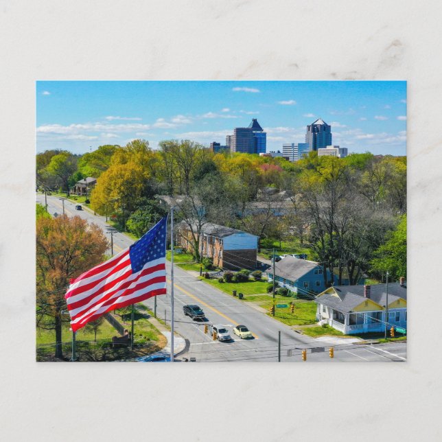 Above Greensboro, NC skyline with American Flag Holiday Postcard (Front)