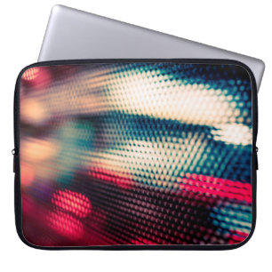 abstract background with bokeh defocused lights an laptop sleeve