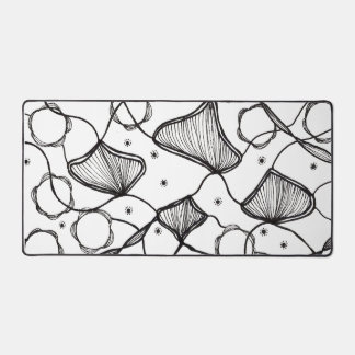Abstract design of leaves in the wind desk mat