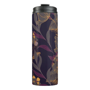 Abstract drawing of flowers and leaves on a golden thermal tumbler