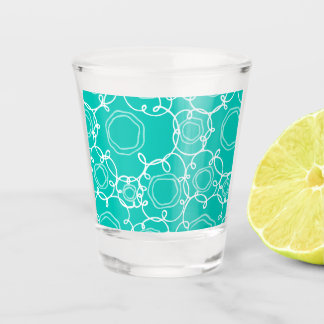 ABSTRACT FLORAL PATTERN IN TEAL SHOT GLASS